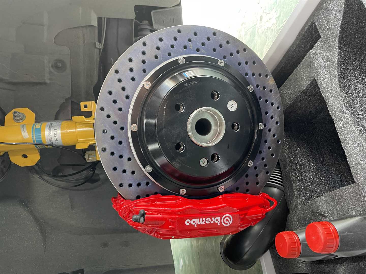 Replaced Brembo brake discs, calipers, brake lines, and KW rear suspension, front section of the vehicle, published by Mach5 Performance.